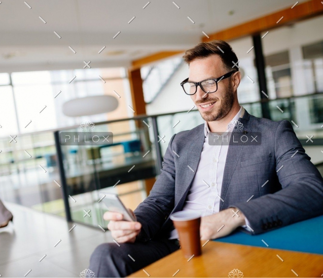 demo-attachment-657-businessman-taking-a-break-with-a-cup-of-coffee-JW4B3DH